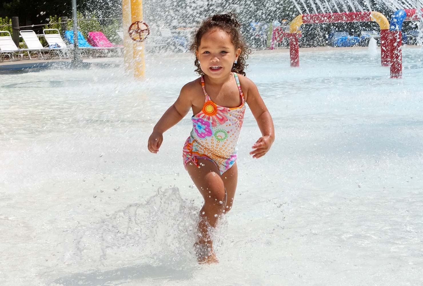 girl playing at a water park