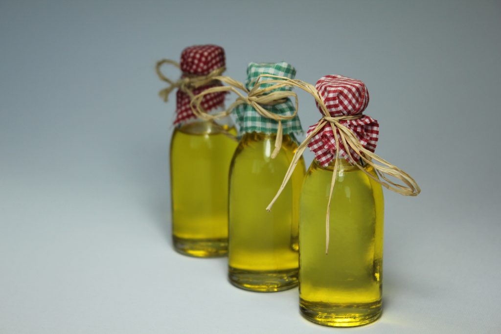 3 olive oil bottles with country style.