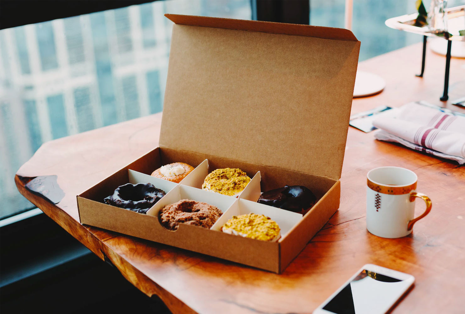 Box of donuts and coffee.