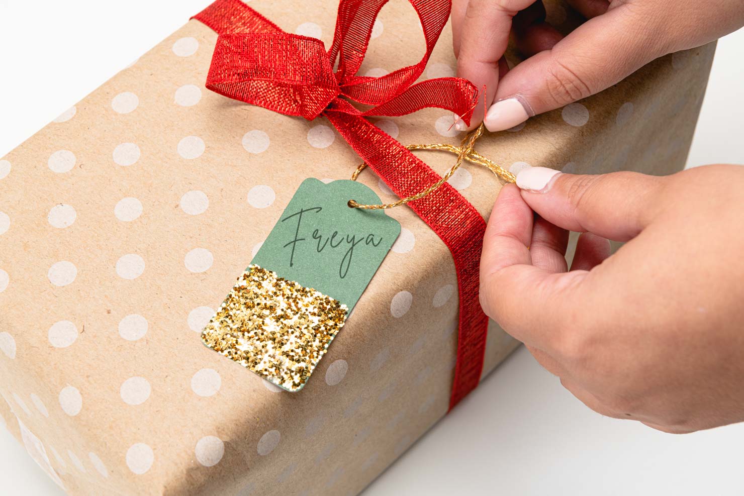 a Christmas gift with a cute glitter gift tag on it.