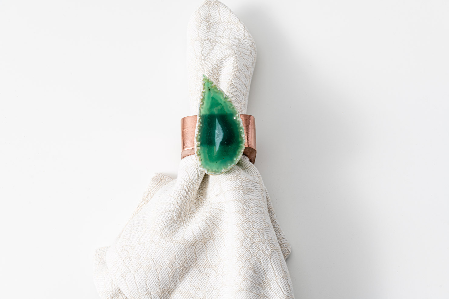 A green geode napkin ring.