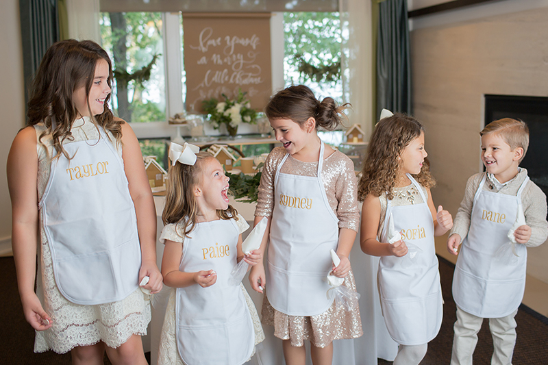 kids in custom aprons at gingerbread party