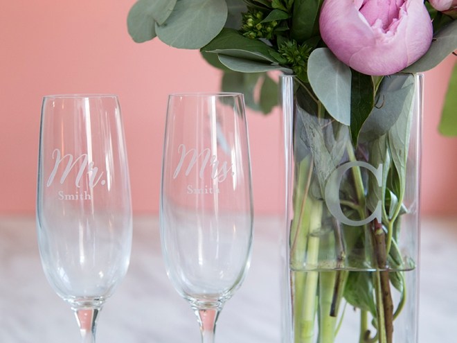 two champagne flutes and flower vase for wedding