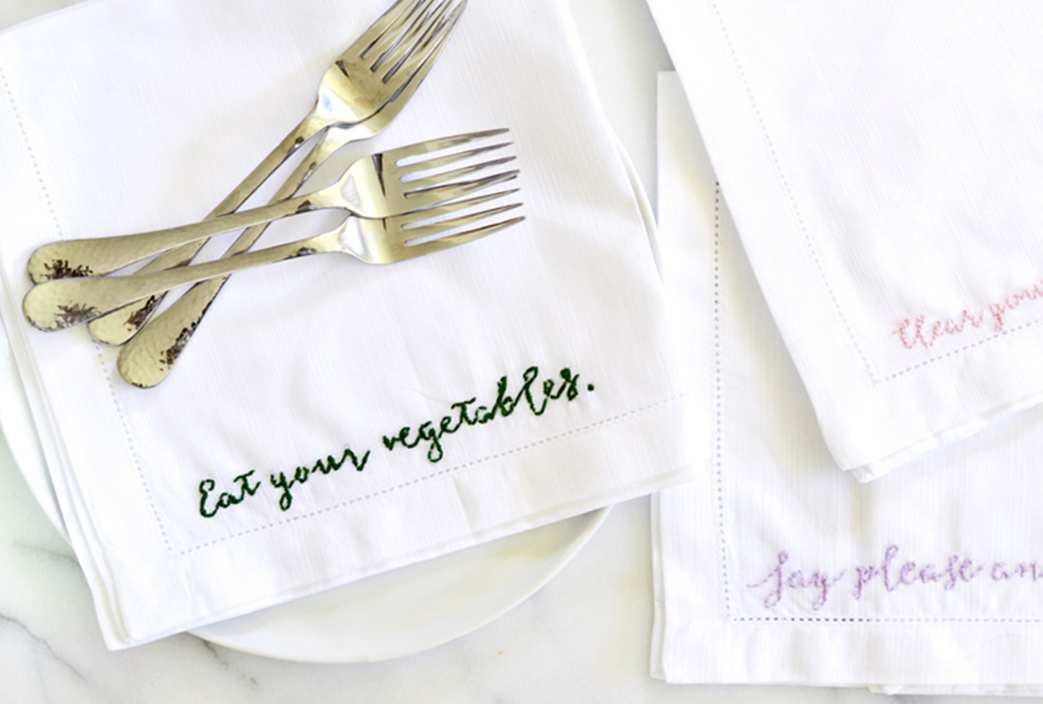 napkins embroidered with slogans