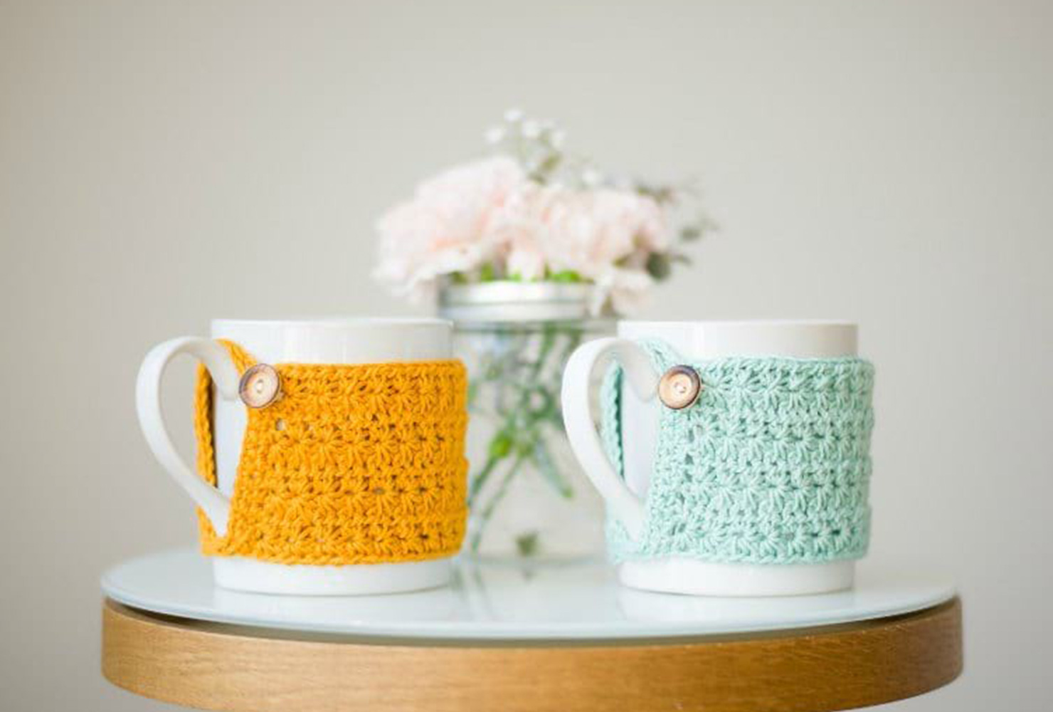 two mugs with handmade tea cozies