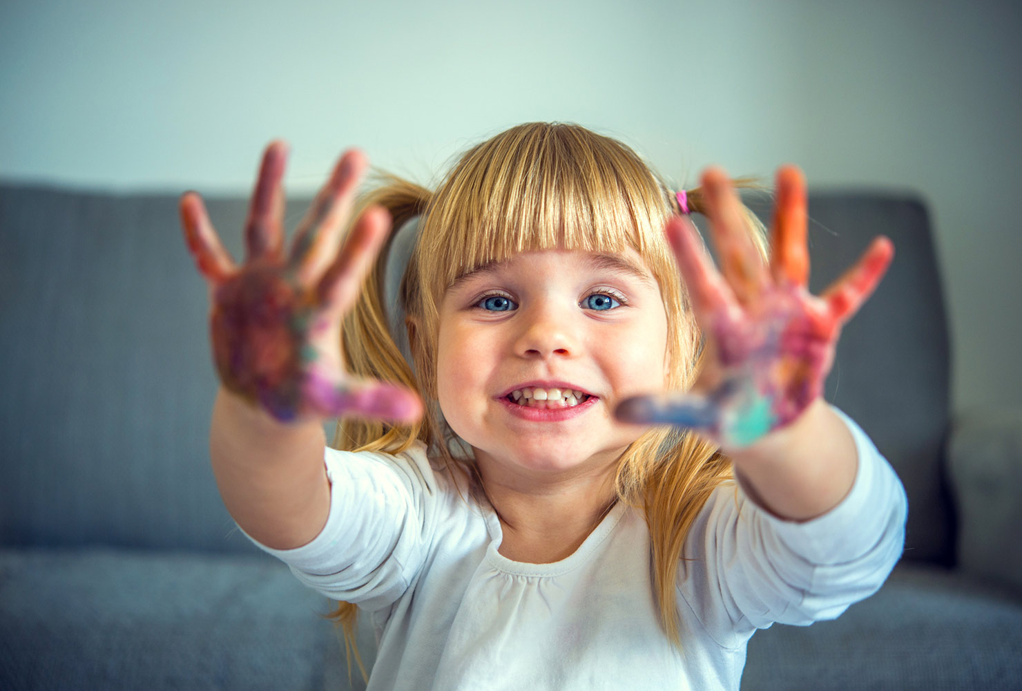 kid crafting with messy hands