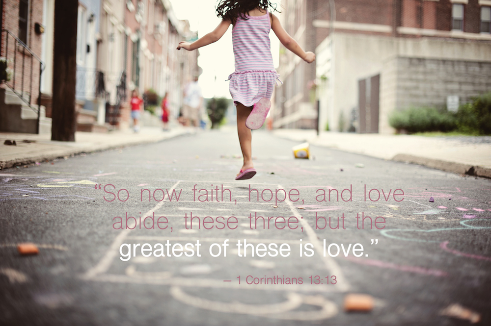 child skipping with faith, hope, love bible quote.
