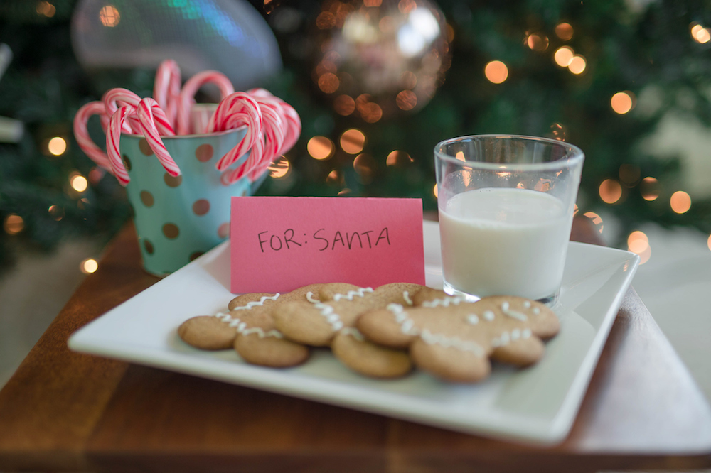 A family puts out Christmas cookies and milk for Santa for their Family Christmas Traditions