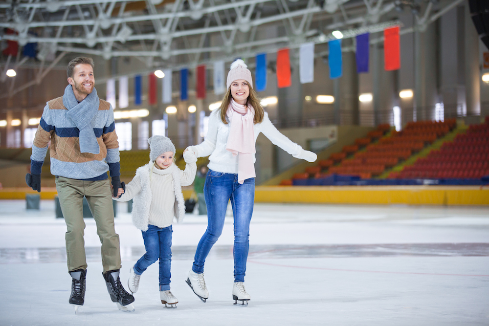 a family ice skates for their family Christmas Traditions