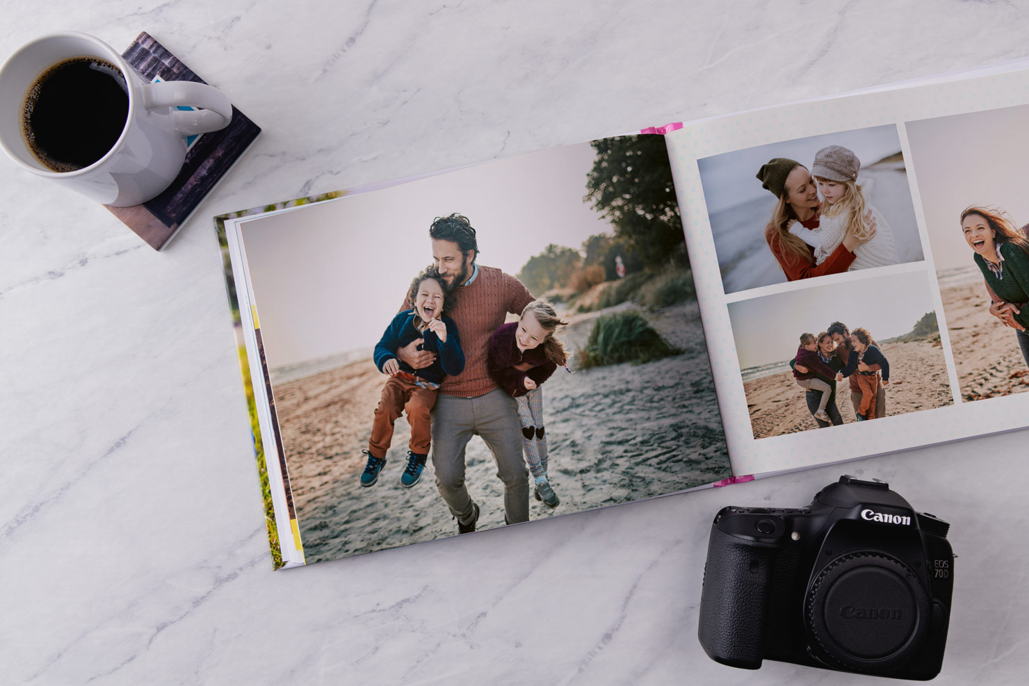 photo album and camera on marble surface used as a coffee table photo book
