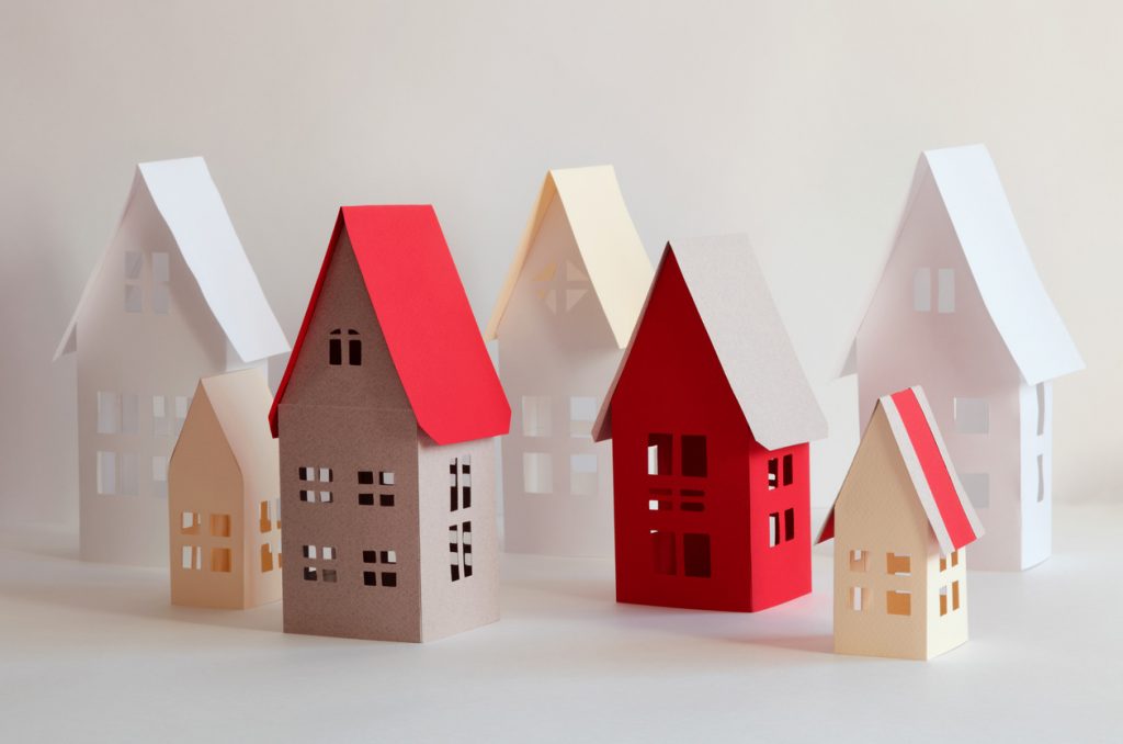 Houses from paper and a color cardboard as a Christmas craft idea.