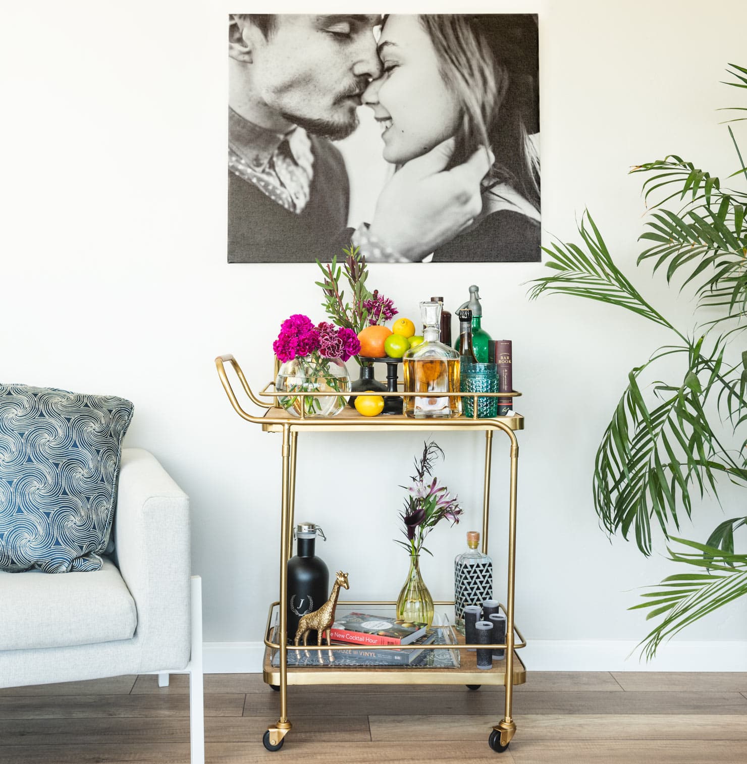 bar cart with a photo above it 