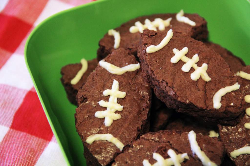 Football-shaped brownies with white chocolate details.