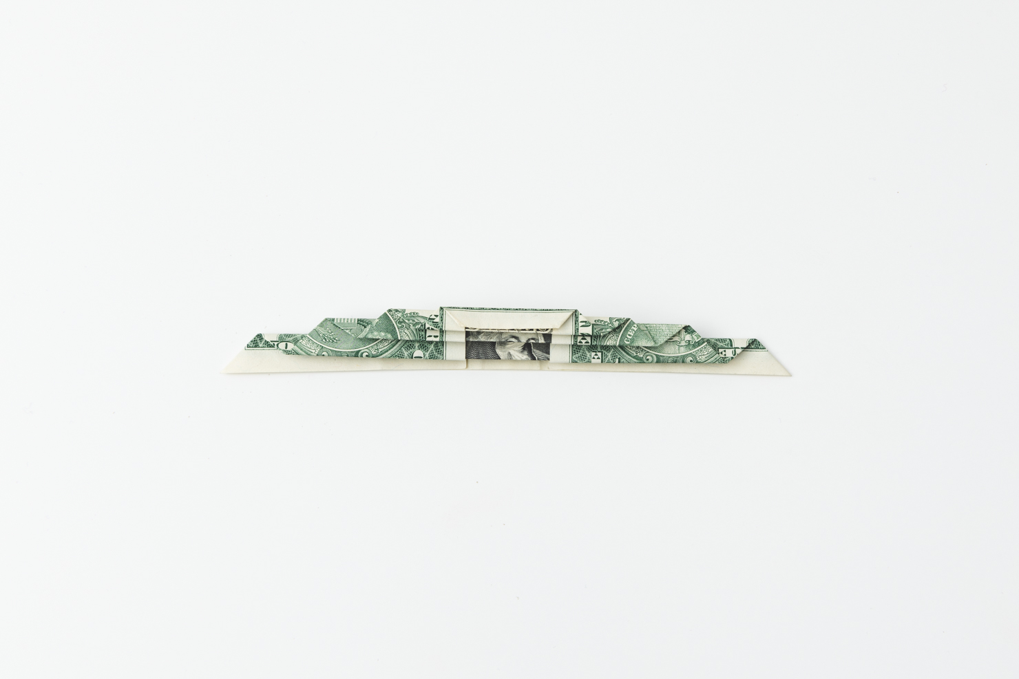 dollar bill folded all the way down