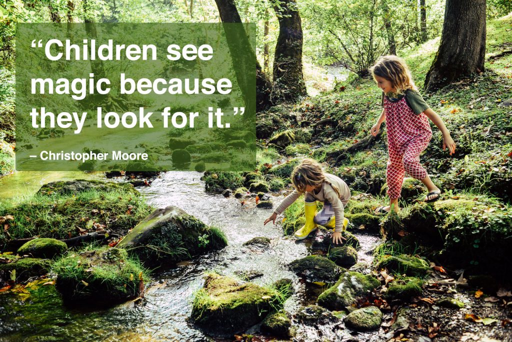Two children having an adventure, climbing and stepping in a river with children quotes overlay