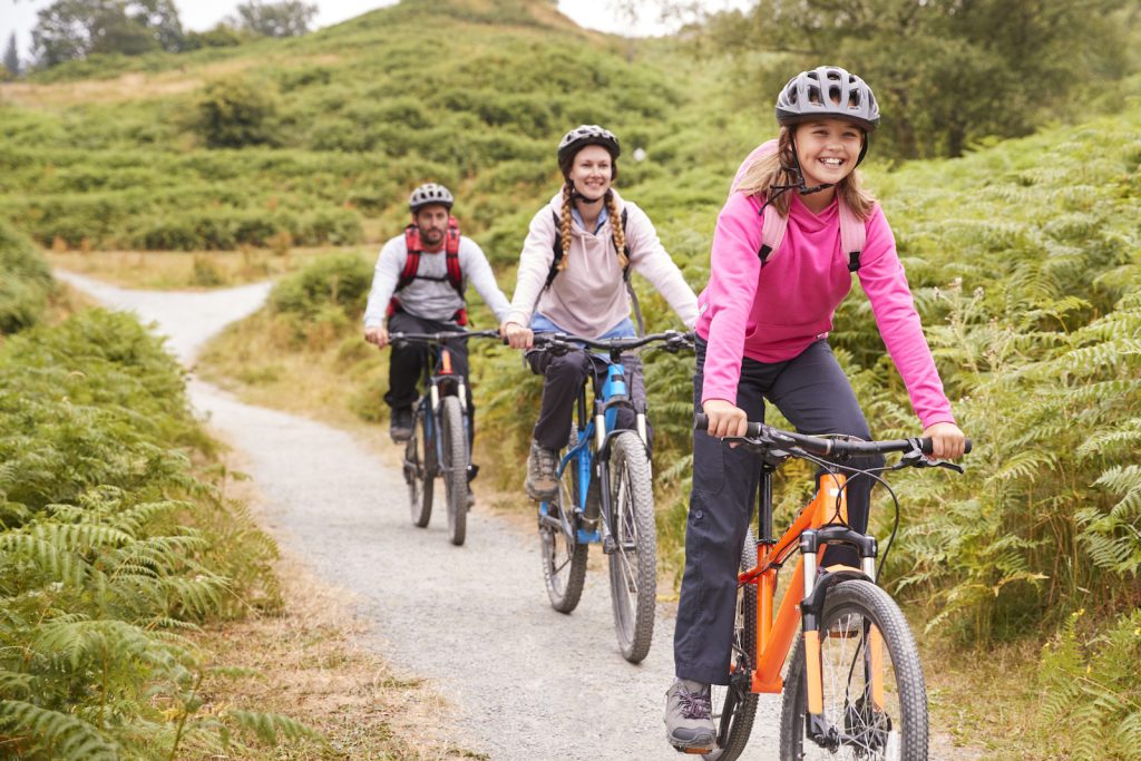 Mountain biking and camping are fun summer vacation ideas for this family. 