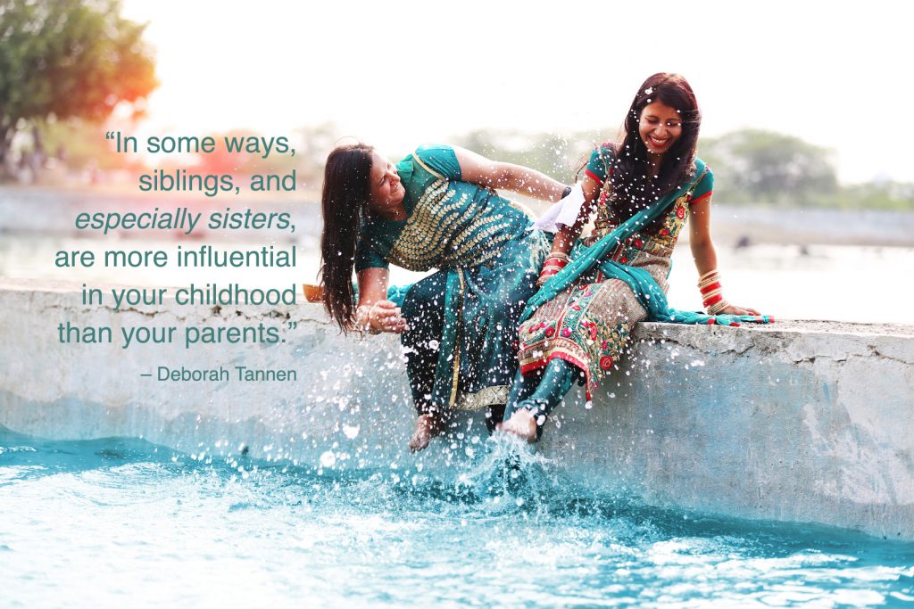 Two sisters playing in the water with a siblings quotes overlay