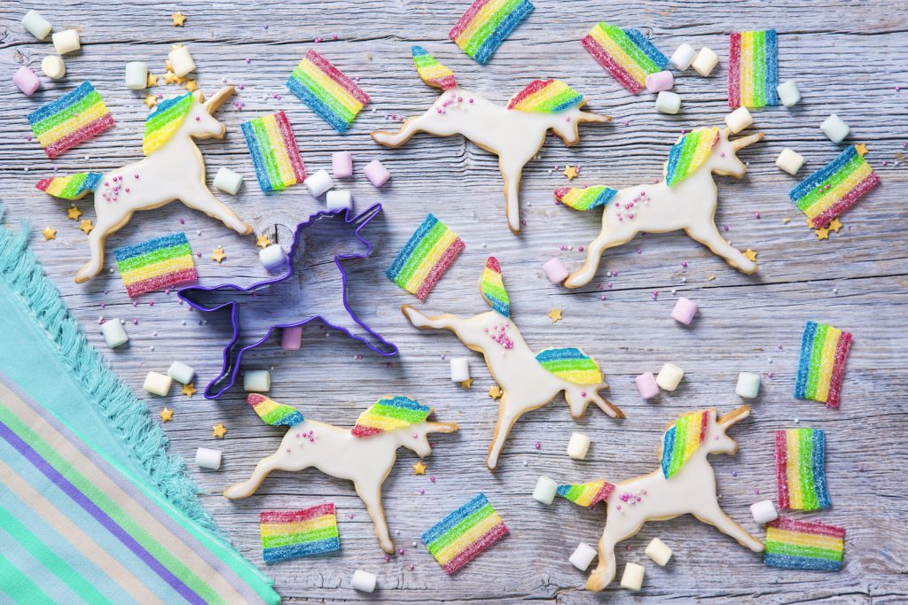 Unicorn cookies on a wooden background