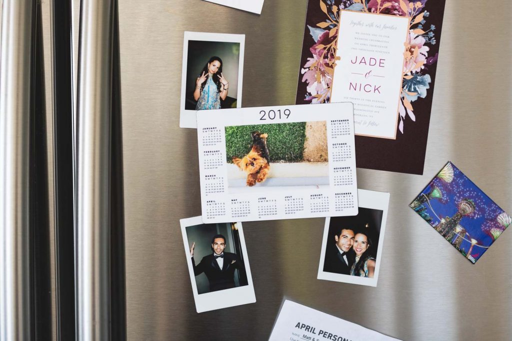 A magnet calendar on a fridge.