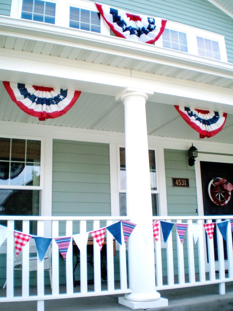 Decorations on the front of the house for a 4th of July cookout.