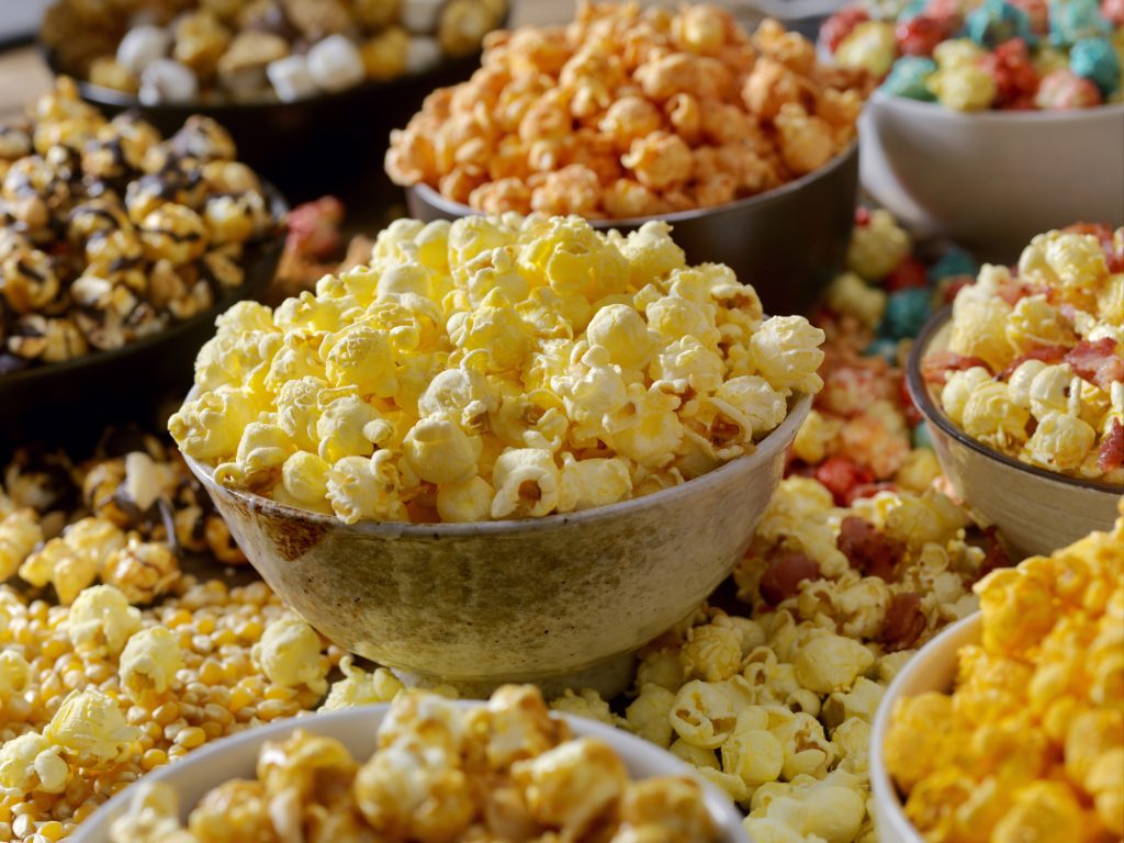 Favorite popcorn toppings, Butter, Cheddar, Smores, Caramel, Candied, Hot and Spicy and Chocolate Peanut.
