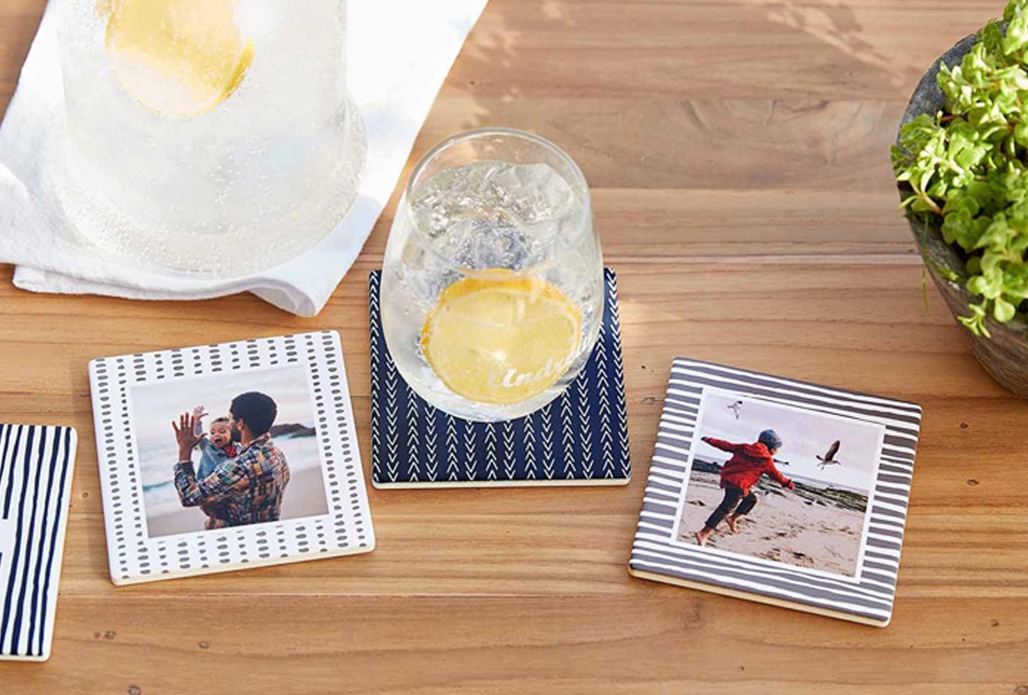 Travel photo coasters with lemonade. 