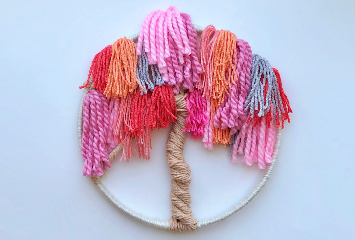 Pink embroidery hoop of tree.