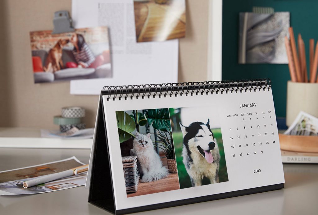 Desktop calendar on display on a desk.