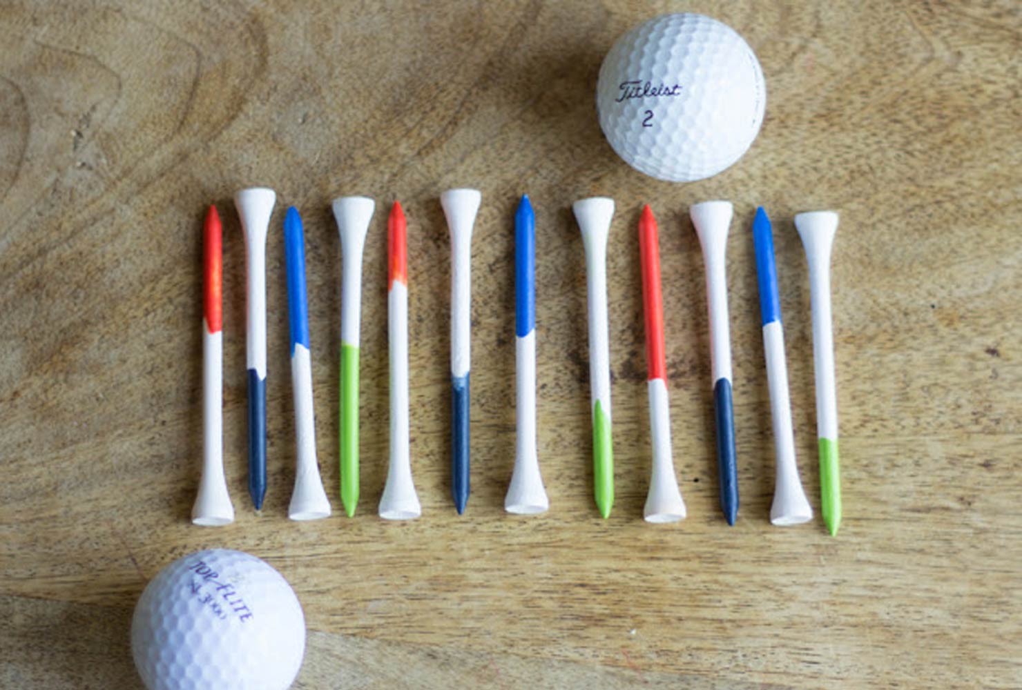 Paint dipped golf tees and golf balls.