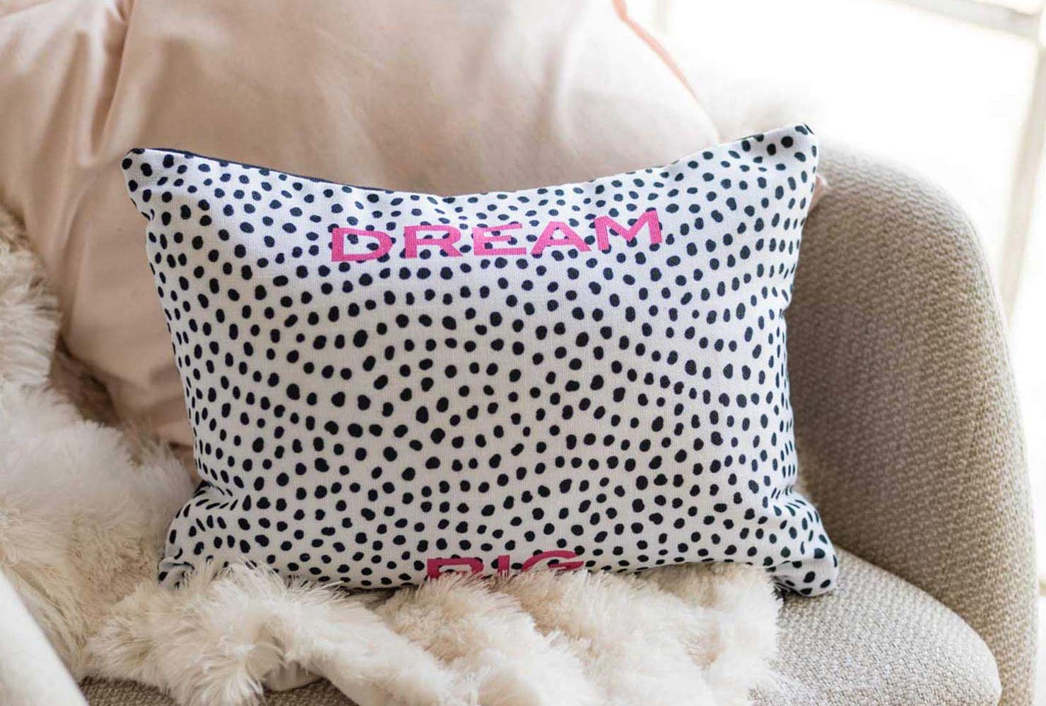 Black and white dotted pillow.