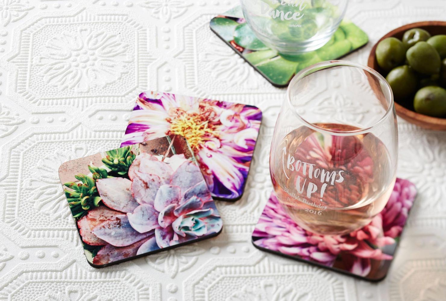 Photo coasters and stemless wine glass.