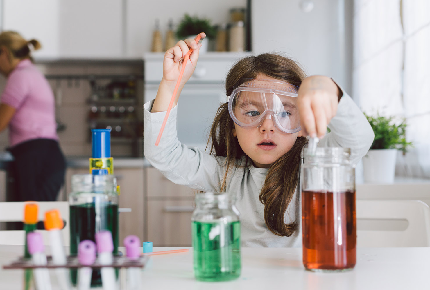 Girl playing with science experiment.