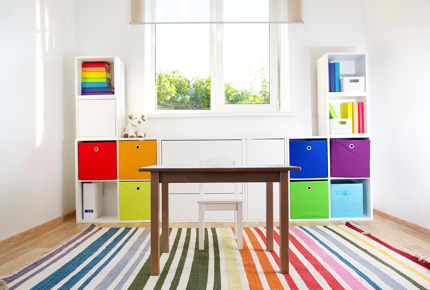 Rainbow color coded shelves.