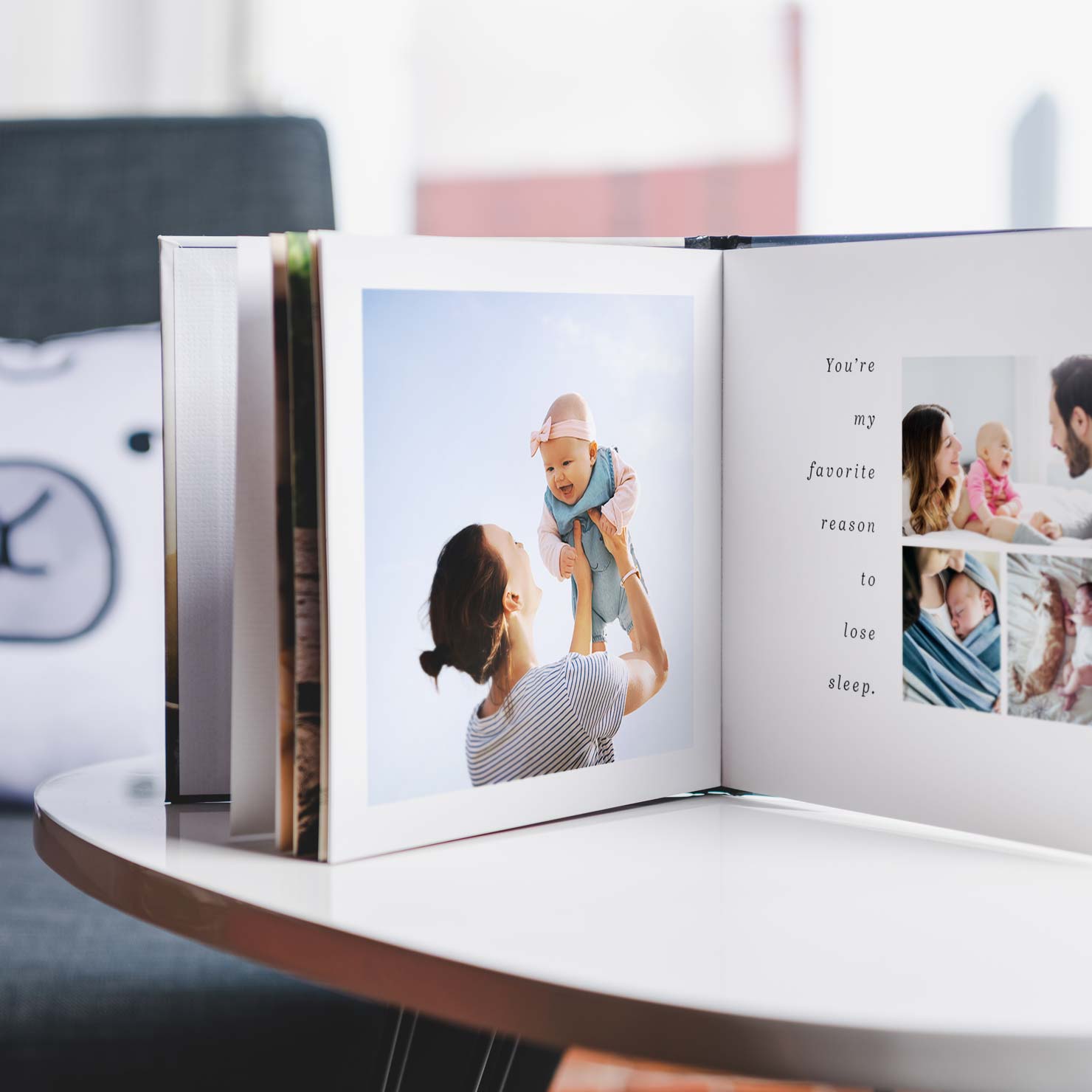 A baby photo book on a table.