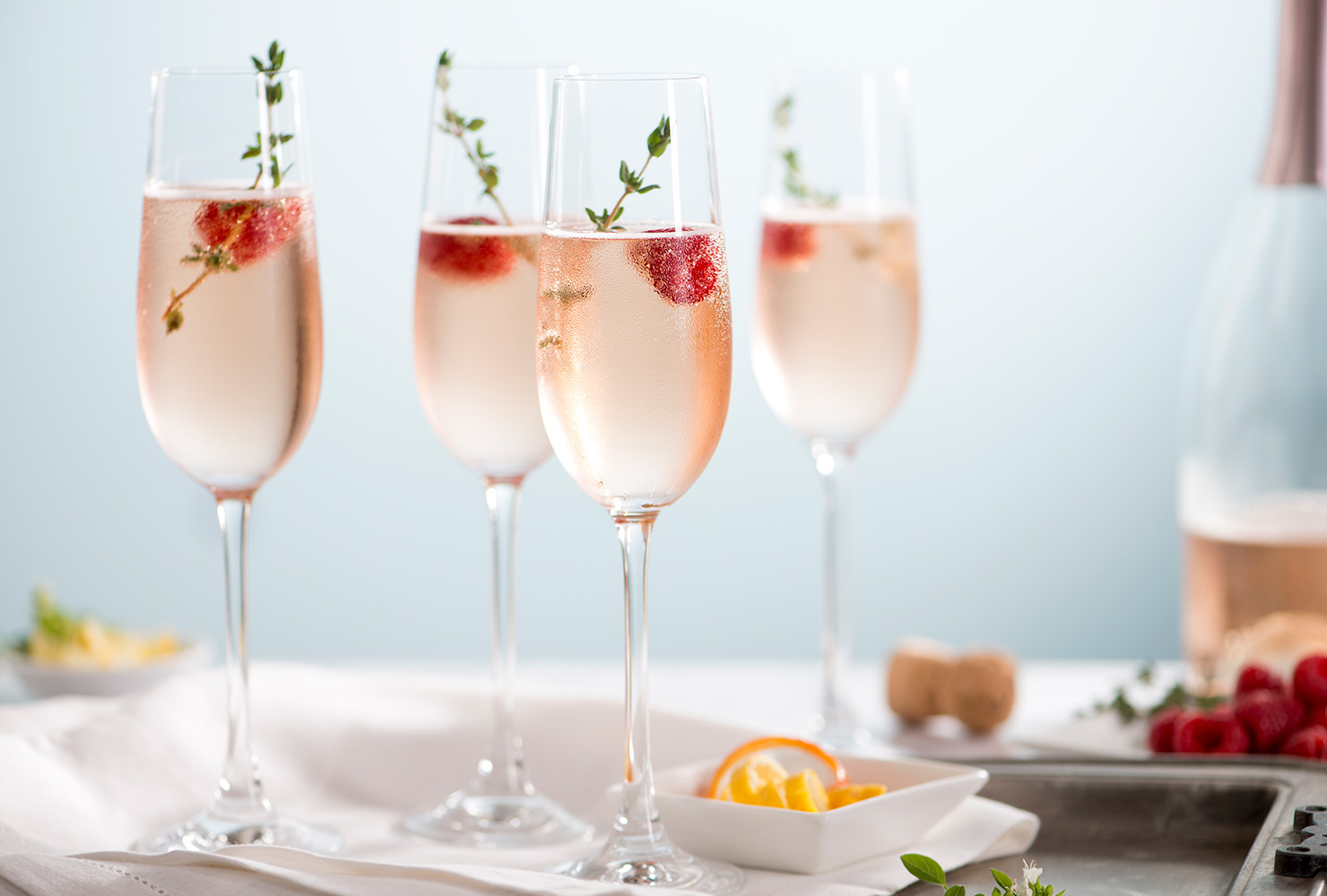 Champagne flutes with fruit.