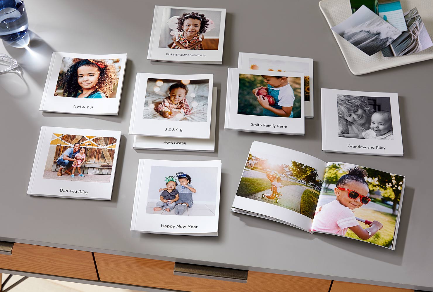mini square softcover photo books laid out on table