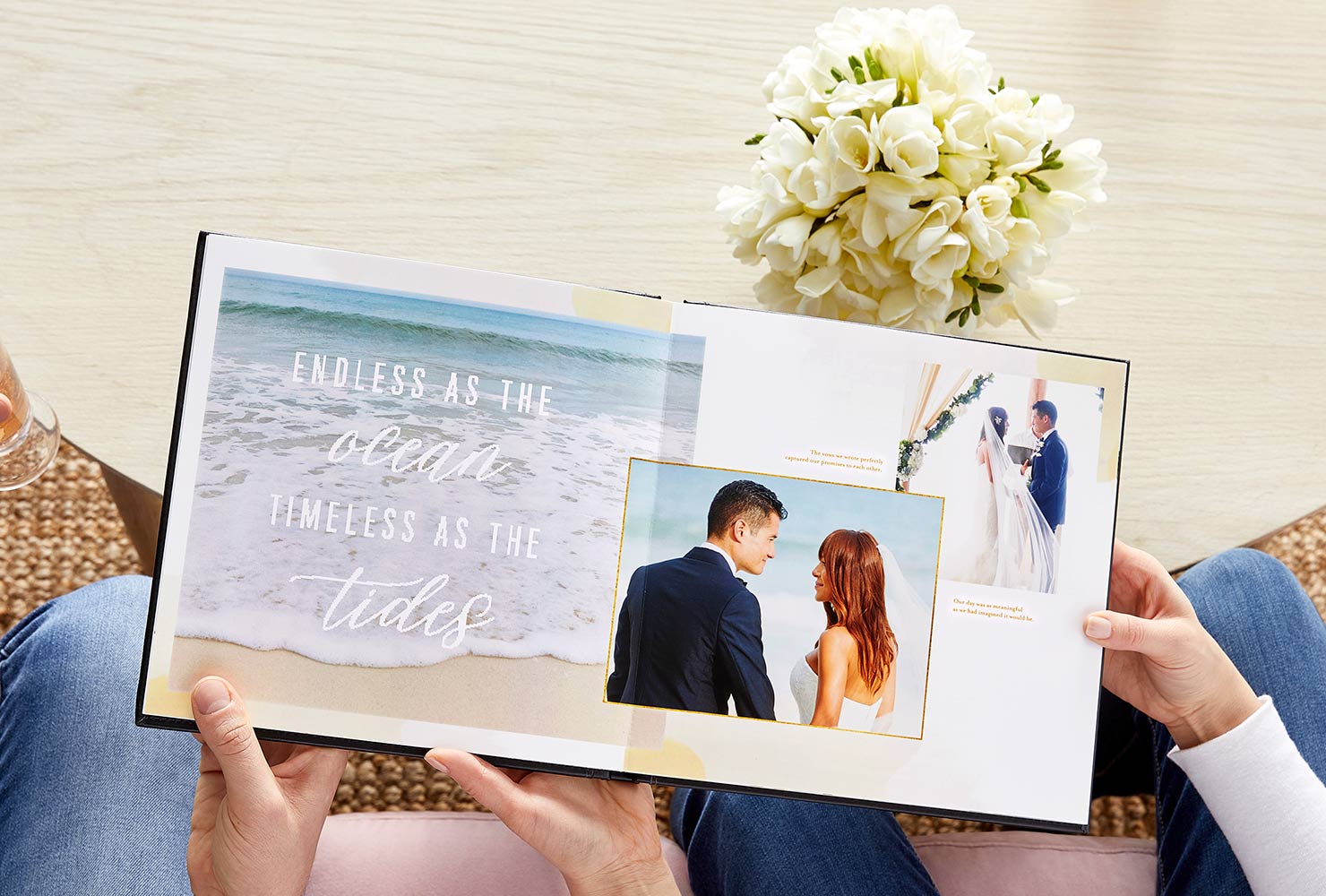 Hands holding beach wedding photo book