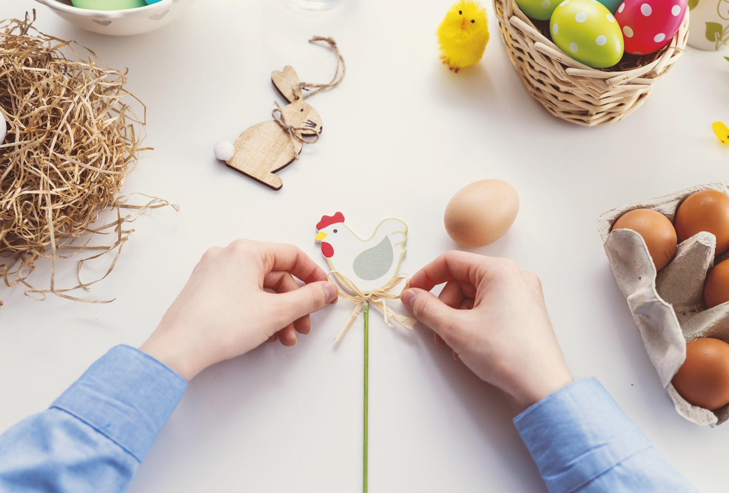 Person making Easter crafts.