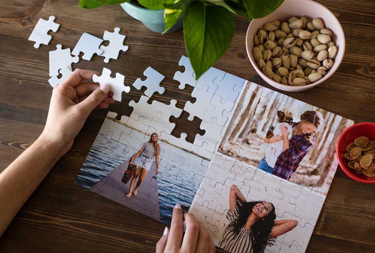 Person putting together a collage puzzle.